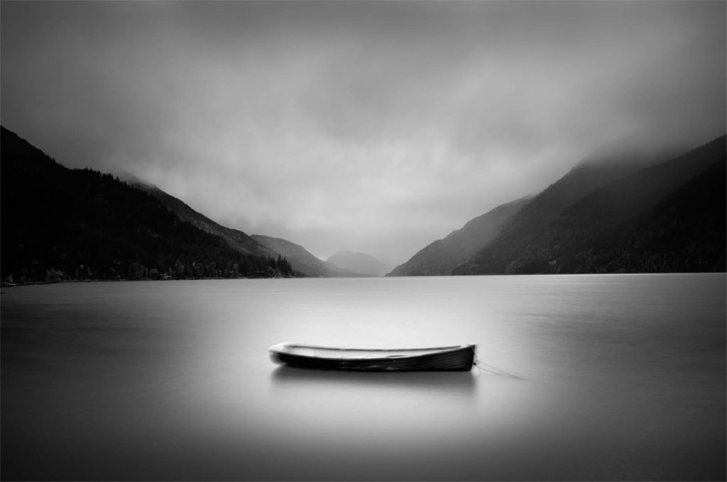 Lone Boat photograph by Chuck Kimmerle